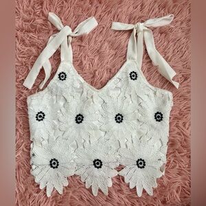 Francesca’s white floral top that ties at the top. Lightly Worn